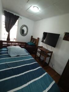 Postel nebo postele na pokoji v ubytování Casa Kitus
