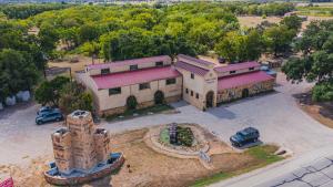an aerial view of a large building with a tower at Peach Cabin in Fredericksburg