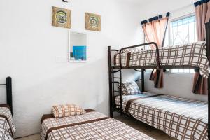 Vuode tai vuoteita majoituspaikassa Hotel Posada Edem