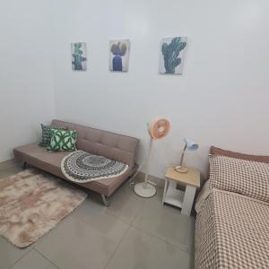 Posezení v ubytování HOMELY @ Green 2 Residences SMDC DLSUMC