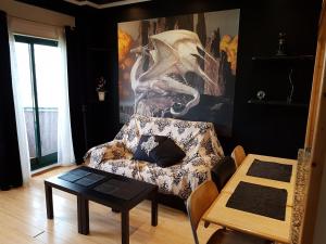 a living room with a couch and a table at Playa Samil Vigo Reformado 2016 in Vigo