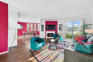 a living room with a couch and a table at Beverly Hills Chic 2 bed 2bath with Patio and Parking 309 in Los Angeles