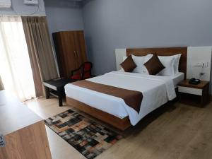 Postelja oz. postelje v sobi nastanitve Hotel Balgopal