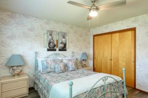 a bedroom with a bed and two tables with lamps at 531 Dolliver in Pismo Beach