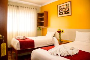 Postel nebo postele na pokoji v ubytování HOSTAL CASA INKAS