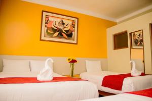 Postel nebo postele na pokoji v ubytování HOSTAL CASA INKAS