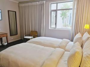 开普顿上东区希尔顿逸林酒店客房内的一张或多张床位