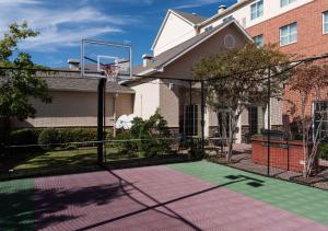a basketball hoop in front of a house at Homewood Suites by Hilton Irving-DFW Airport in Irving