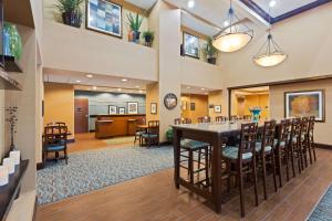 a large lobby with a large table and chairs at Hampton Inn Leesburg Tavares in Leesburg