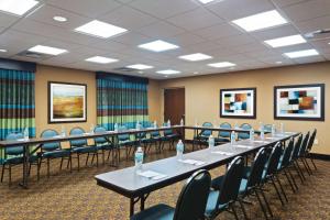a conference room with a long table and chairs at Hampton Inn Leesburg Tavares in Leesburg