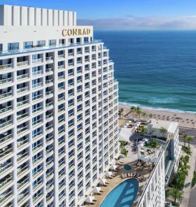 an aerial view of the coral hotel and the beach at Conrad Fort Lauderdale Beach in Fort Lauderdale