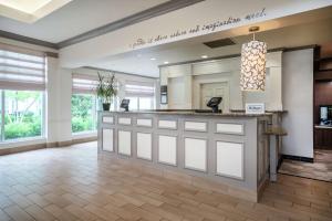 a lobby with a reception counter in a hospital at Hilton Garden Inn Louisville East in Louisville