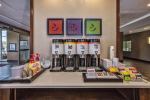 a counter with a bunch of products on it at Hampton Inn by Hilton West Bloomfield Novi in Farmington Hills