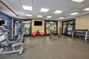 a gym with several treadmills and cardio machines at Hampton Inn Southfield/West Bloomfield in Farmington Hills