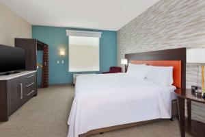 a bedroom with a large bed and a television at Home2 Suites By Hilton Tucson Airport, Az in Tucson +23 photos