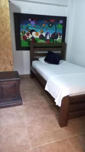 Uma cama ou camas num quarto em Casa Turistica Zamboss