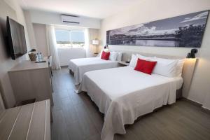 Postel nebo postele na pokoji v ubytování Super 8 by Wyndham Manzanillo