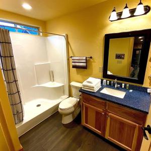 a bathroom with a shower and a toilet and a sink at Cedar Mountain -Suite C in Grants Pass