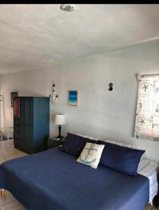 Ένα ή περισσότερα κρεβάτια σε δωμάτιο στο Punta Piedra studios +46 φωτογραφίες