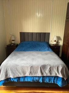 a bedroom with a large bed with two night stands at Suite 391 in Canela