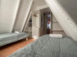 Postel nebo postele na pokoji v ubytování ALPINA Cabaña de Mar - Puerto Madryn