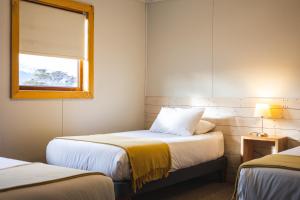Giường trong phòng chung tại Hotel FioFio SPA
