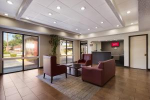 a lobby of a hospital with chairs and a waiting room at Red Roof Inn & Suites Statesboro - University in Statesboro