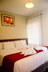 Postel nebo postele na pokoji v ubytování HOSTAL CASA INKAS