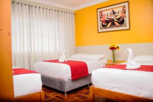 Postel nebo postele na pokoji v ubytování HOSTAL CASA INKAS