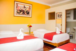 Postel nebo postele na pokoji v ubytování HOSTAL CASA INKAS + 8 fotografií