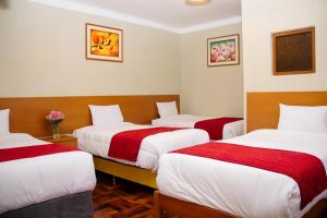Postel nebo postele na pokoji v ubytování HOSTAL CASA INKAS