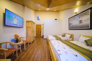 TV a/nebo společenská místnost v ubytování 688 Hotel Đà Lạt