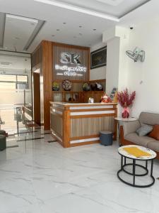 a lobby with a waiting area with a couch and a table at SK BOUTIQUE HOTEL in Phú Quốc +33 photos