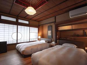 Lova arba lovos apgyvendinimo įstaigoje NIPPONIA HOTEL 伊賀上野 城下町
