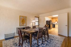 a dining room with a table and chairs at Nob Hill Home with Private Yard! in Albuquerque