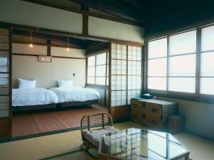 Letto o letti in una camera di NIPPONIA Chichibu Monzenmachi