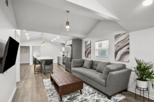 a living room with a couch and a table at 4-Bed 2-Bath Pet Friendly Home in Heart of Atlanta in Atlanta