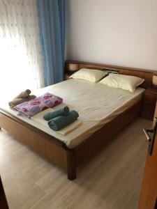 a bedroom with a bed with two towels on it at STOUDIO VOUL in Alexandroupoli