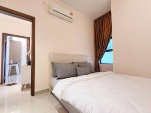 a white bedroom with a bed and a window at D'Secret Tropika - 2 Bedrooms 4 Pax, Free Parking in Johor Bahru