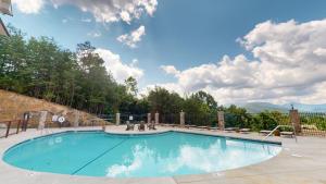 a large swimming pool with a blue at Viewpoint Condominiums in Pigeon Forge