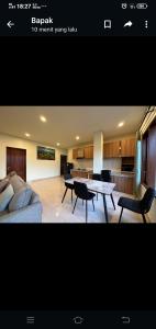 a living room with a couch and a table at Apartment Wayan in Canggu