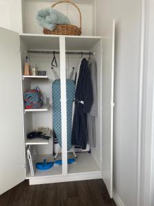 a walk in closet with a white shelving unit at Pickmere Waters in Kerikeri