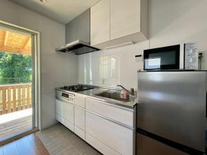 Köök või kööginurk majutusasutuses Surfside Cottage - サーフサイドコテージ九十九里 +10 fotot