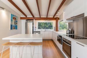a kitchen with a white counter and a window at The Pole House in Elizabeth Beach