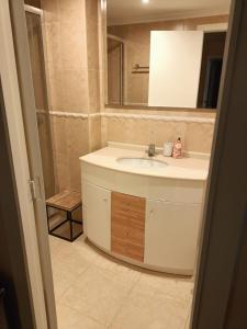 a bathroom with a sink and a mirror at Flat in Castellon in Castellón de la Plana