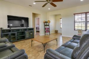 a living room with two couches and a flat screen tv at McKinney Home with Backyard, 10 Mi to Dtwn! in McKinney