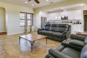 a living room with two couches and a table at about 10 Mi to Dtwn McKinney Home with Patio and Yard in McKinney +16 photos