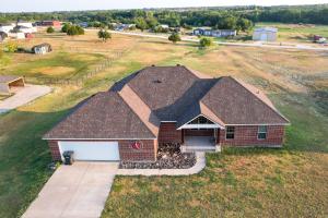 an aerial view of a house with a roof at McKinney Home with Backyard, 10 Mi to Dtwn! in McKinney