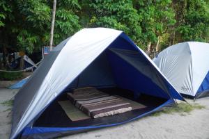 a blue and white tent with a mattress in it at Redang Campstay in Redang Island