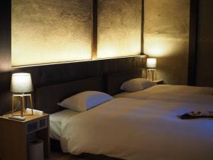 Lova arba lovos apgyvendinimo įstaigoje NIPPONIA HOTEL 伊賀上野 城下町